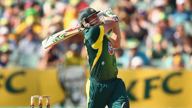 James Faulkner swings hard in his man-of-the-match performance for Australia against England on Australia Day, 2014. Picture: Robert Cianflone (Getty Images).