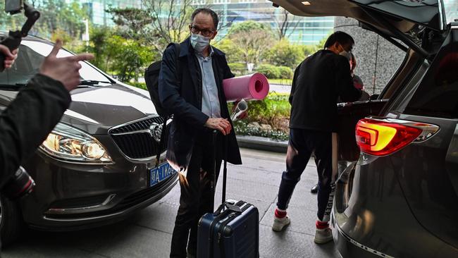 WHO team member Peter Ben Embarek, centre, at Tianhe International Airport before departing Wuhan on Wednesday. Picture: AFP