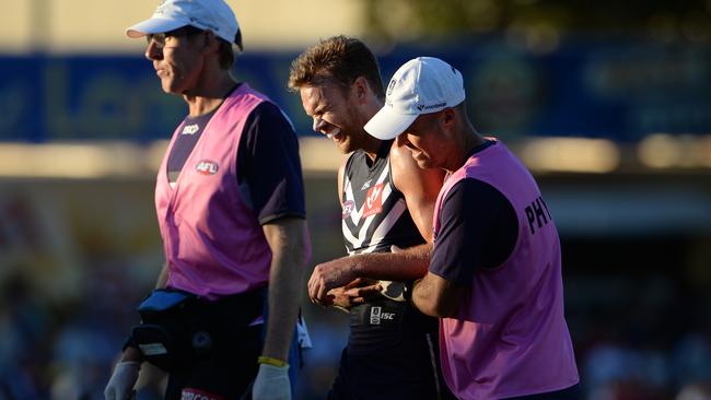 Paul Duffield leaves the field in the hands of the trainers with a shoulder injury. Picture: Daniel Wilkins