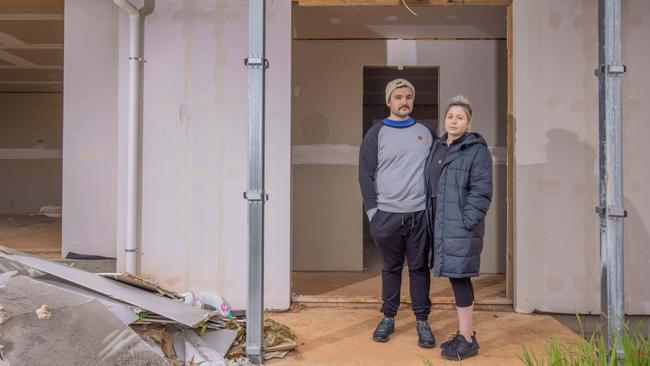 Felmeri customers Danita and Jordan outside their unfinished home at O'Halloran Hill. Picture: Ben Clark