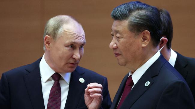 Vladimir Putin speaks to Xi Jinping during the Shanghai Cooperation Organisation leaders' summit in Samarkand in September. Picture: AFP.