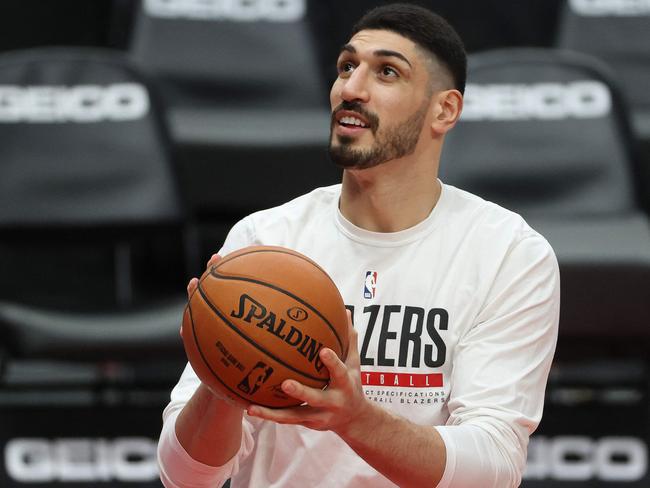 (FILES) In this file photo taken on February 20, 2021 Enes Kanter #11 of the Portland Trail Blazers warms up before their game against the Washington Wizards at Moda Center in Portland, Oregon. - NBA player Enes Kanter slammed China's President Xi Jinping as a "brutal dictator" and declared that "Tibet belongs to the Tibetan people" on October 20, 2021, risking reigniting tensions between Beijing and the US basketball league. Kanter, who plays as a center for the Boston Celtics, wrote on Twitter: "Dear Brutal Dictator XI JINPING and the Chinese Government. Tibet belongs to the Tibetan people!" (Photo by Abbie Parr / GETTY IMAGES NORTH AMERICA / AFP)