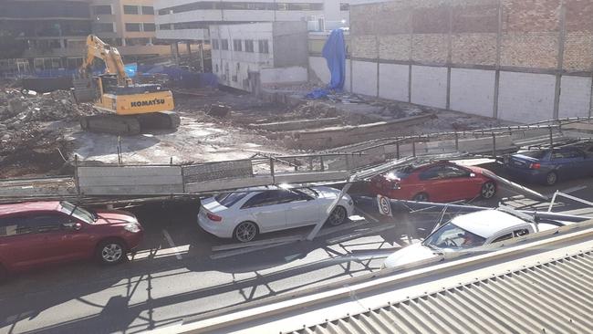 Scaffolding collapse at a construction site in Mann St Gosford has seen one woman rushed to hospital with head injuries.