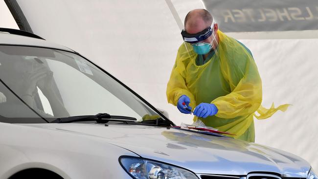 A medic performs COVID-19 tests on a member of the public at a drive-through COVID-19 testing centre on Bondi Beach. Picture: AFP