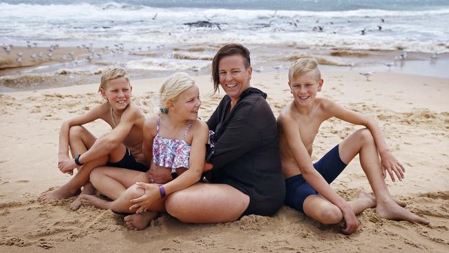 Nikki Stewart, who almost drowned in the ocean as a child, is extremely careful about beach swimming with her children (from left) Mason, Evie and Blake. Picture: Sam Ruttyn