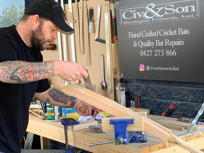 Adam Ciavarella works on a bat in his Rosebud carport.