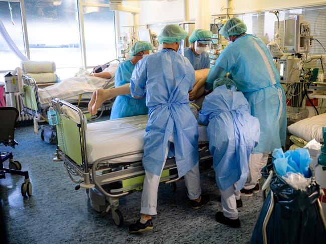 Doctors and nurses tend to a patient on the Covid-19 intensive care unit at University Hospital Leipzig. Picture: Getty Images