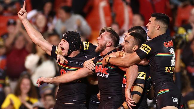 Kurt Capewell celebrates his try with Panthers teammates. Picture: Cameron Spencer/Getty Images