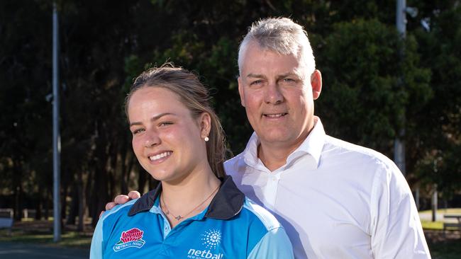 Audrey Little, with her father and former Wallaby Jason Little. Little was selected as part of the first ever Swifts netball Academy.