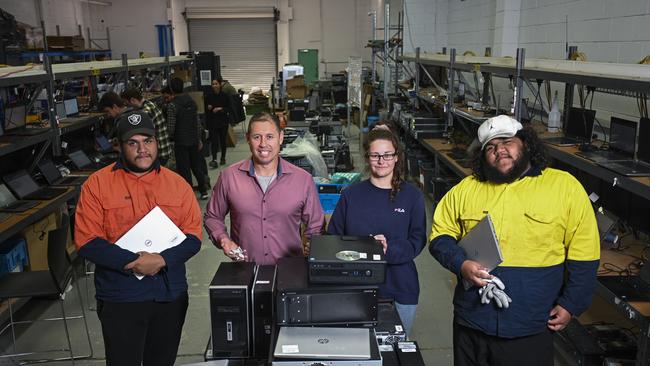 IT trainees Nick Williams, Cherie Walker and Elijah Williams with CEO Kurt Gruber of WV Technologies in Canberra. Picture: NCA NewsWire / Martin Ollman