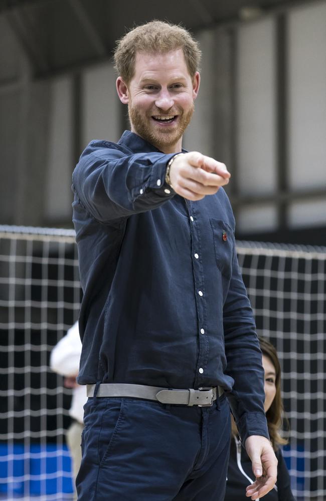 Britain's Prince Harry speaks to wheelchair rugby athletes as he visits the Nippon Foundation Para Arena in Tokyo. Picture: AP