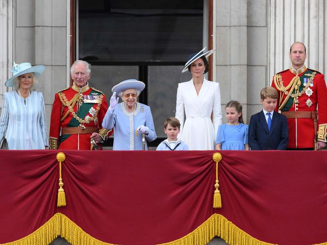 Britain's Queen Elizabeth II (C) stands with from left, Camilla, Duchess of Cornwall, Britain's Prince Charles, Prince of Wales, Britain's Prince Louis of Cambridge, Britain's Catherine, Duchess of Cambridge, Britain's Princess Charlotte of Cambridge, Britain's Prince George of Cambridge, Britain's Prince William, Duke of Cambridge, to watch a special flypast from Buckingham Palace balcony. Picture: AFP