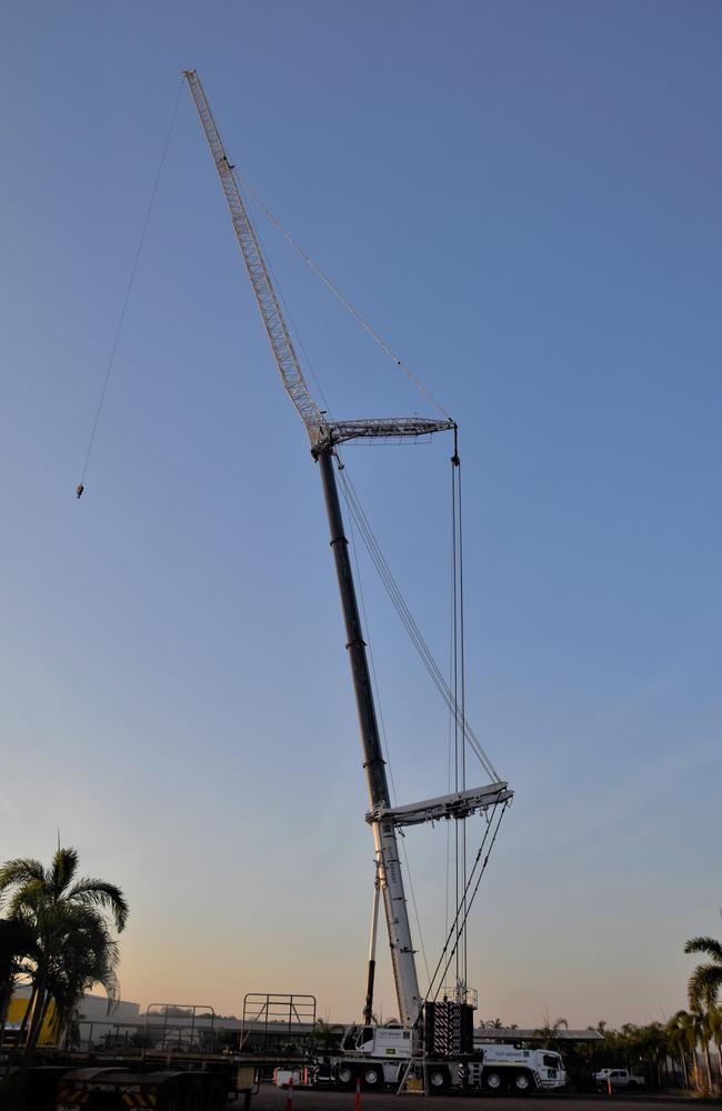 A Tutt Bryant crane lifted a 'man cage' 134m in the air. Counterweighted by 135 tonnes of concrete, the machinery can lift up to seven tonnes of weight. At it's full height, the crane is about 24m taller than the Territory's tallest building – the Evolution – which stands at about 100m. Picture: Sierra Haigh