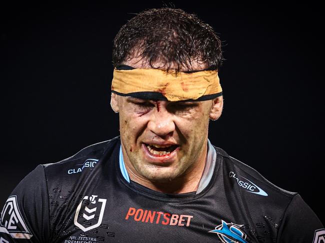 SYDNEY, AUSTRALIA - MARCH 23: 7 Dale Finucane of the Sharks walks off after receiving a cut during the round three NRL match between Wests Tigers and Cronulla Sharks at Leichhardt Oval, on March 23, 2024, in Sydney, Australia. (Photo by Jeremy Ng/Getty Images)
