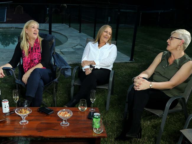 Katarina Carroll enjoys a joke with her sisters-in-law, Jo Bosnjak and Pauline Bosnjak.Photo by David Clark