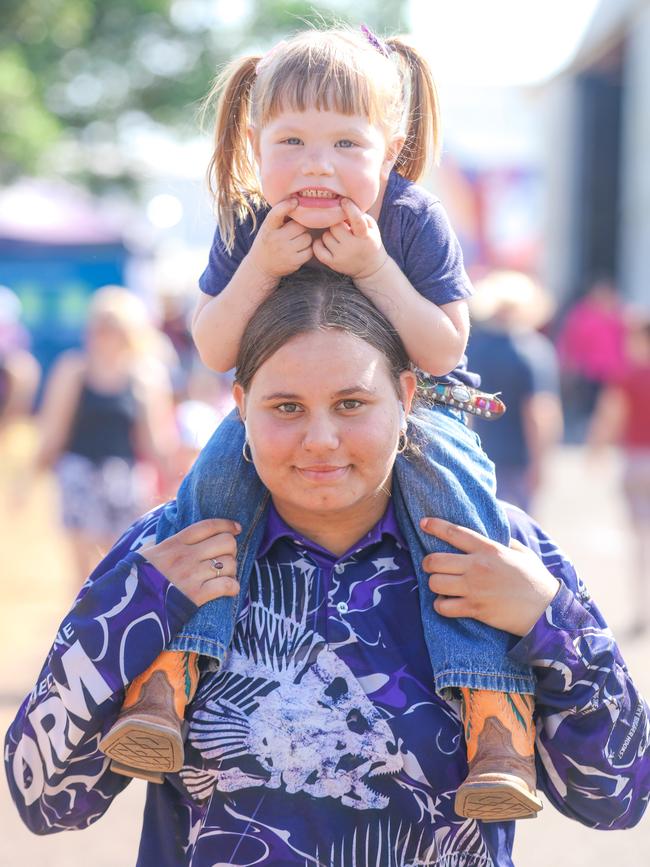 Ashley Downman, 17, Prim-Rose Di Pasquale, 2, enjoying day two of the Royal Darwin Show. Picture: Glenn Campbell