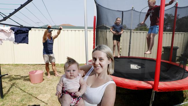 Angie Barnes and baby Gracie with husband Jake and kids Jade, 6, and Rylan, 11, at home in Ingleburn in Sydney’s west. Picture: Nikki Short