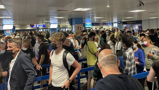 Passengers at Manchester Airport where travel has been restored.