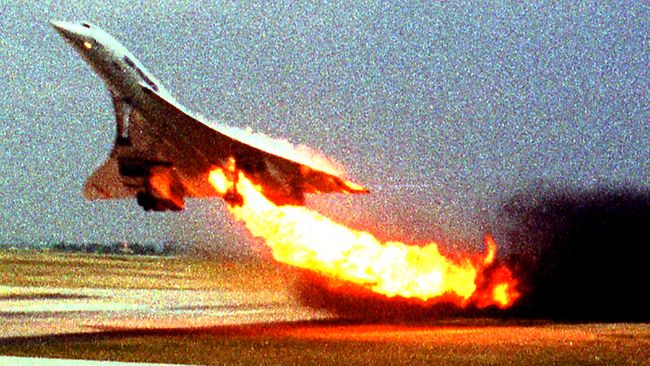 On July 25, 2000, Air France Concorde flight 4590 takes off with fire trailing from its engine on the left wing from Charles de Gaulle airport in Paris / AP / Toshihiko Sato