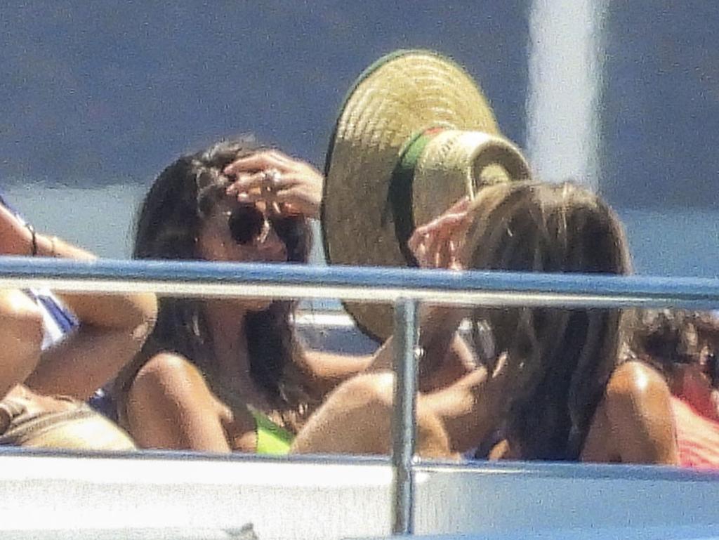 Pia kept the hat within arm’s length as she lounged around with friends and family. Picture: ©MEDIA-MODE.COM