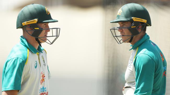 Marnus Labuschagne and Tim Paine talk tactics during a net session ahead of the SCG Test against India. Picture: Mark Metcalfe/Getty Images