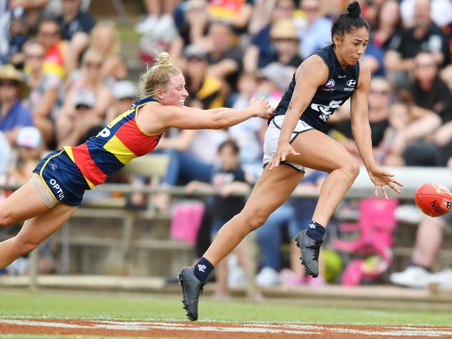 Dayna Cox of the Crows attempts to stop Darcy Vescio of the Blues during the Round 4 AFLW match between the Adelaide Crows and the Carlton Blues at Richmond Oval in Adelaide, Sunday, March 1, 2020. (AAP Image/David Mariuz) NO ARCHIVING, EDITORIAL USE ONLY