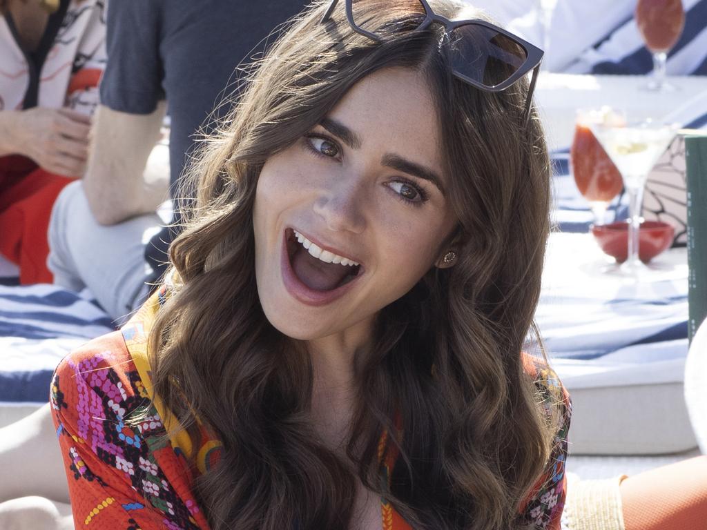 Emily in Paris. Lily Collins as Emily in episode 202 of Emily in Paris. Cr. Carole Bethuel/Netflix © 2021