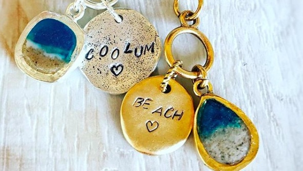 Under the Noosa Collective design label, Cathie Withyman has a range of earrings, necklaces and bracelets, using sand from beaches, to turn memories into physical keepsakes.