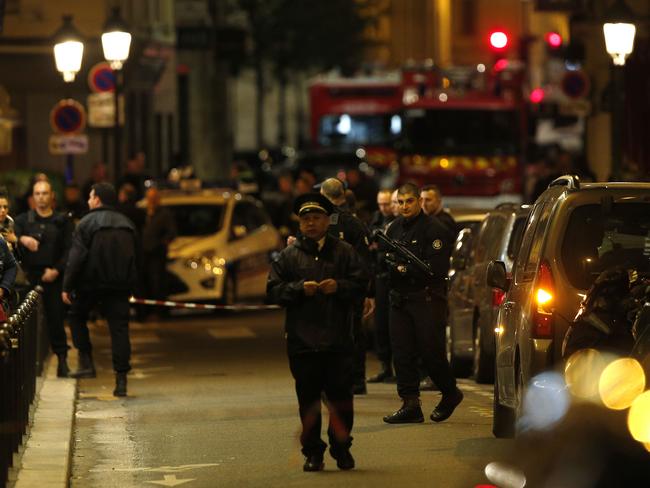 Police officers secure the area after a knife attack in central Paris. Picture: AP