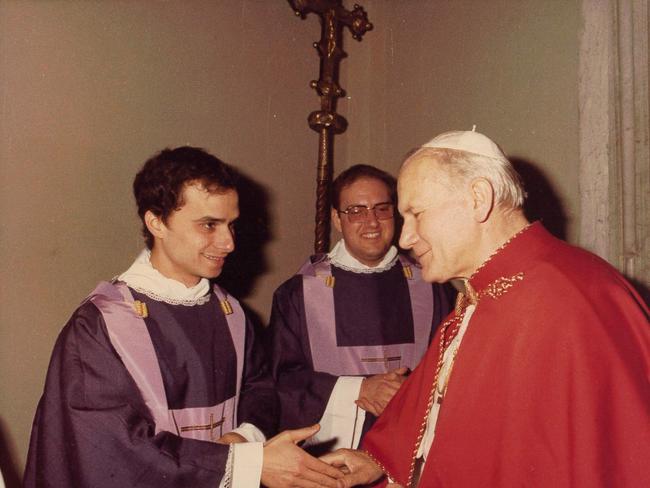 Robert Prevost before he became Pope Leo XIV - with Pope John Paul II. Picture: Courtesy of the Midwest Augustinian Province of Our Mother of Good Counsel