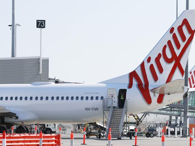 DO NOT USE, EMBARGO, HOLD COURIER MAIL FUTURE TOURISM CAMPAIGN A Virgin Australia plane at the International Terminal of Brisbane Airport on Friday, August 30, 2019. (AAP Image/Claudia Baxter)