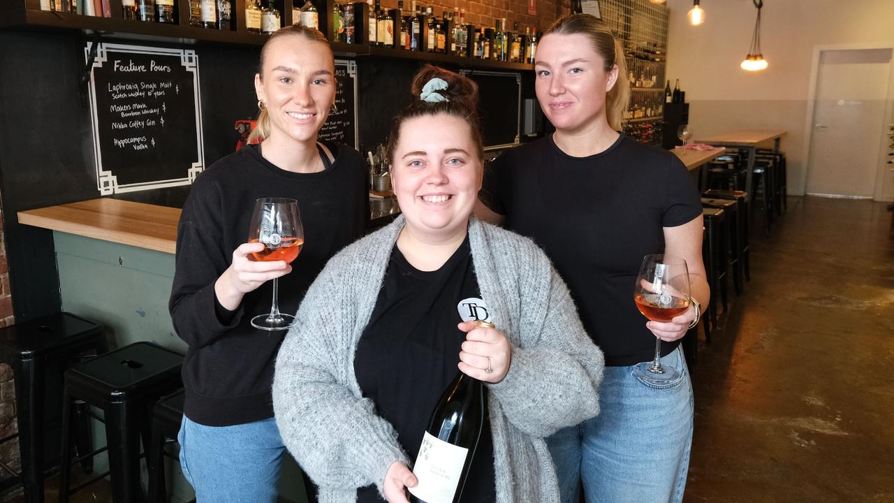 Timber Door Cellars opened its doors on Friday, much to the delight of Emily Free, manager Leah Whitfield and Claudia Free. Picture: Mark Wilson.