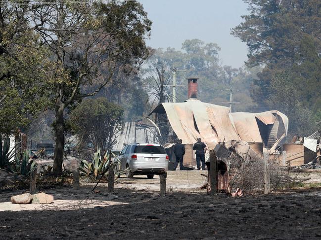 Police survey the damage on Caves Road, Stanthorpe. (AAP/Image Sarah Marshall)