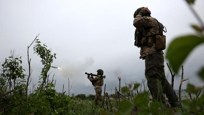 Ukrainian soldiers of the 28th Separate Mechanized Brigade fire a grenade launcher at the front line near the town of Bakhmut, Donetsk region. Picture: AFP