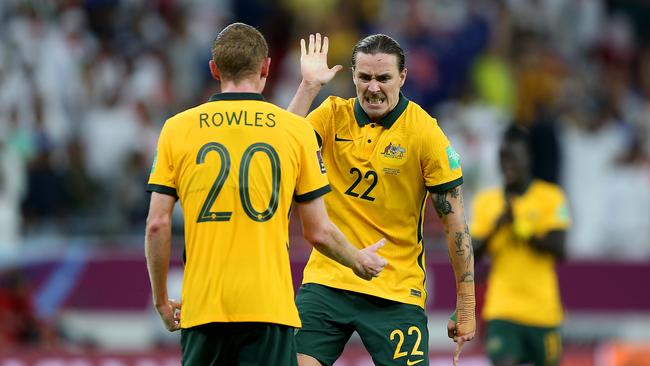 Jackson Irvine and Kye Rowles celebrate Australia’s playoff win over UAE.