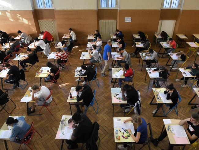 (FILES) In this file photo taken on June 17, 2019 high school students take the philosophy exam, the first test session of the 2019 baccalaureate (high school graduation exam) at the Pasteur high school in Strasbourg, eastern France. - French Education and Youth Affairs Minister Jean-Michel Blanquer announced on April 3, 2020, that the French baccalaureate (high school graduation) final examination will not take place in 2020 but the graduation will be granted on the basis of continuous monitoring, due to the novel coronavirus (COVID-19) epidemic. (Photo by FREDERICK FLORIN / AFP)