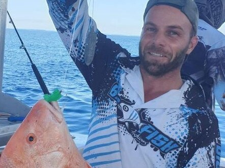 Mark Pace with a fish caught on a Disney Ooshie toy.