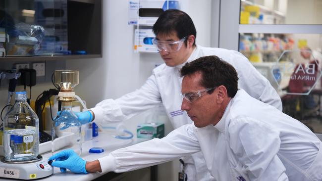 A UQ researcher using a bioreactor, one of the key pieces of equipment in establishing a vaccine candidate. Picture: UQ