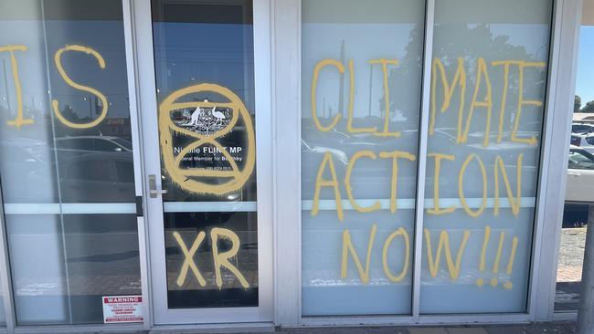 Messages written on Nicolle Flint's office by Extinction Rebellion protesters. Photo: Supplied