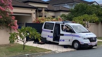 Police at the Edinburgh Rd home in Benowa last month.