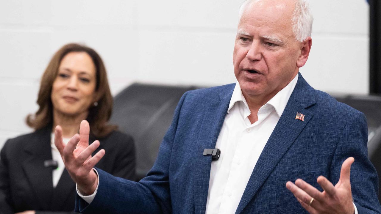 Democratic presidential candidate US Vice President Kamala Harris listen to her running mate, Governor Tim Walz, speak during a visit with members of the marching band at Liberty County High School in Hinesville, Georgia. Picture: SAUL LOEB / AFP