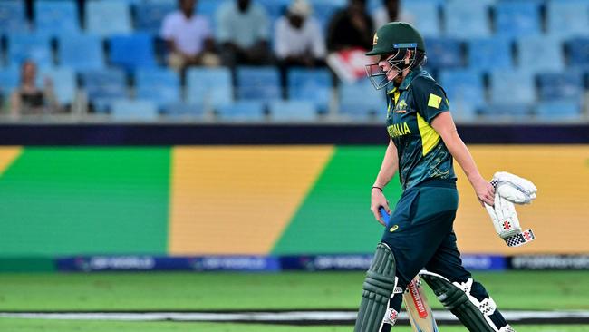 Australia's Beth Mooney walks back to the pavilion after her dismissal during the ICC Women's T20 World Cup cricket semi-final match between Australia and South Africa at the Dubai International Cricket Stadium in Dubai on October 17, 2024. (Photo by Giuseppe CACACE / AFP)