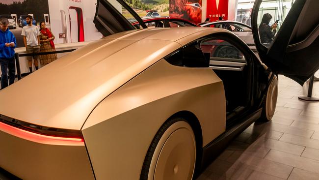 A Tesla Cybercab prototype at a Tesla store in San Jose, California, US, on Tuesday, Nov. 12, 2024. Tesla CEO Elon Musk said the robotaxi, which has no steering wheel or pedals, could cost less than $30,000 and "probably" will go into production in 2026. Photographer: David Paul Morris/Bloomberg