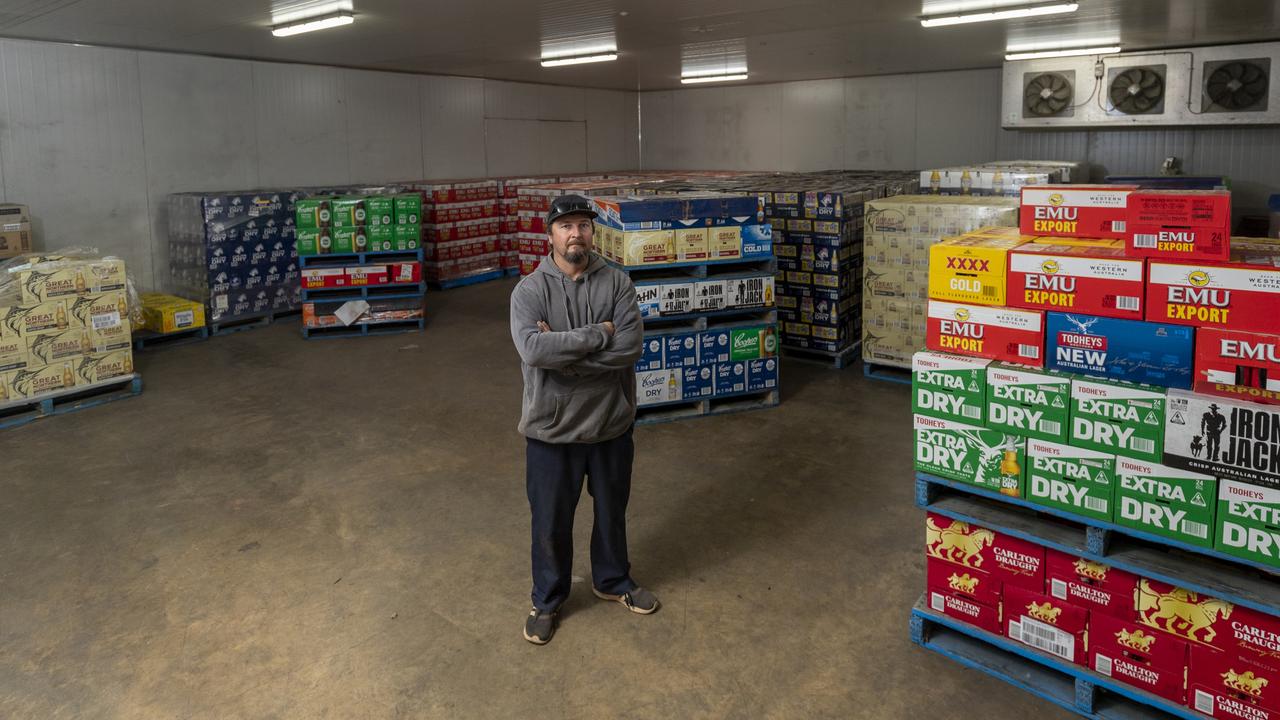 Al's Bottlemart owner Nathan Condo is stuck with over 20 pallets of beer that must be returned to the supplier. Picture: Jon Gellweiler/news.com.au