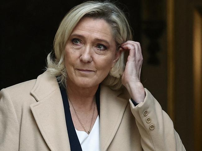 French President of far-right party Rassemblement National (RN) parliamentary group Marine Le Pen leaves after a meeting with French Prime Minister at the Hotel Matignon in Paris on November 25, 2024. (Photo by Anne-Christine POUJOULAT / AFP)