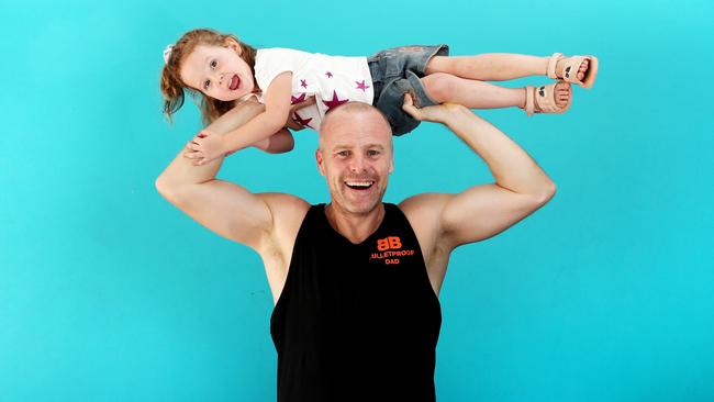 Jay Merrilees, with 3-year-old daughter Scarlett, runs a program called Bulletproof Dad which helps busy working dads get fit, healthy and happy. Picture: Sue Graham