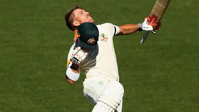 ADELAIDE, AUSTRALIA - DECEMBER 12: David Warner of Australia celebrates after reaching his century during day four of the First Test match between Australia and India at Adelaide Oval on December 12, 2014 in Adelaide, Australia. (Photo by Robert Cianflone/Getty Images)