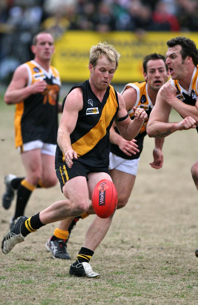 Seaford's Chris Fortnam gets his kick away.