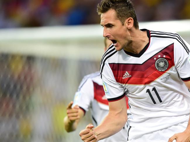 Germany's forward Miroslav Klose celebrates after scoring during a Group G football match between Germany and Ghana at the Castelao Stadium in Fortaleza during the 2014 FIFA World Cup on June 21, 2014. AFP PHOTO / JAVIER SORIANO