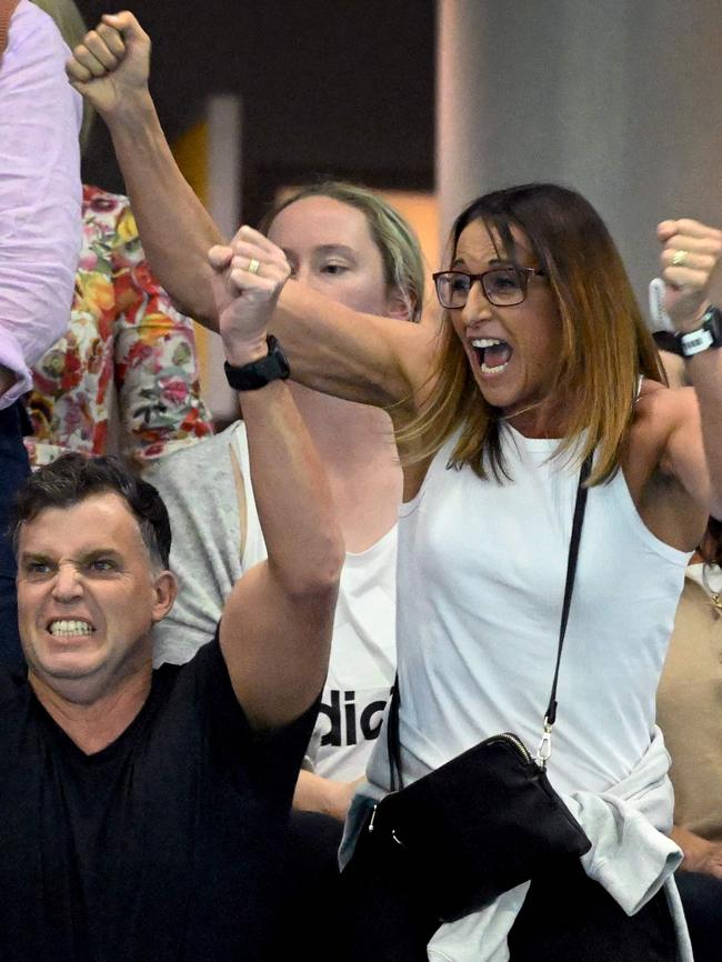 Hayley Lewis and her husband Greg Taylor celebrate in the crowd. Photo by William WEST / AFP